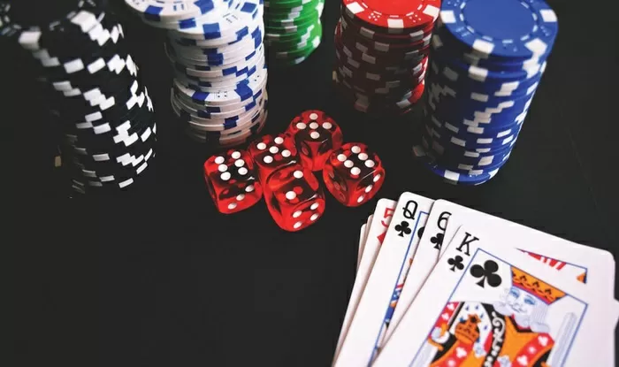 Poker chips, playing cards, and dice