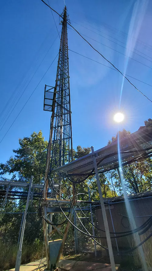 Photo of a large antenna tower from the ground